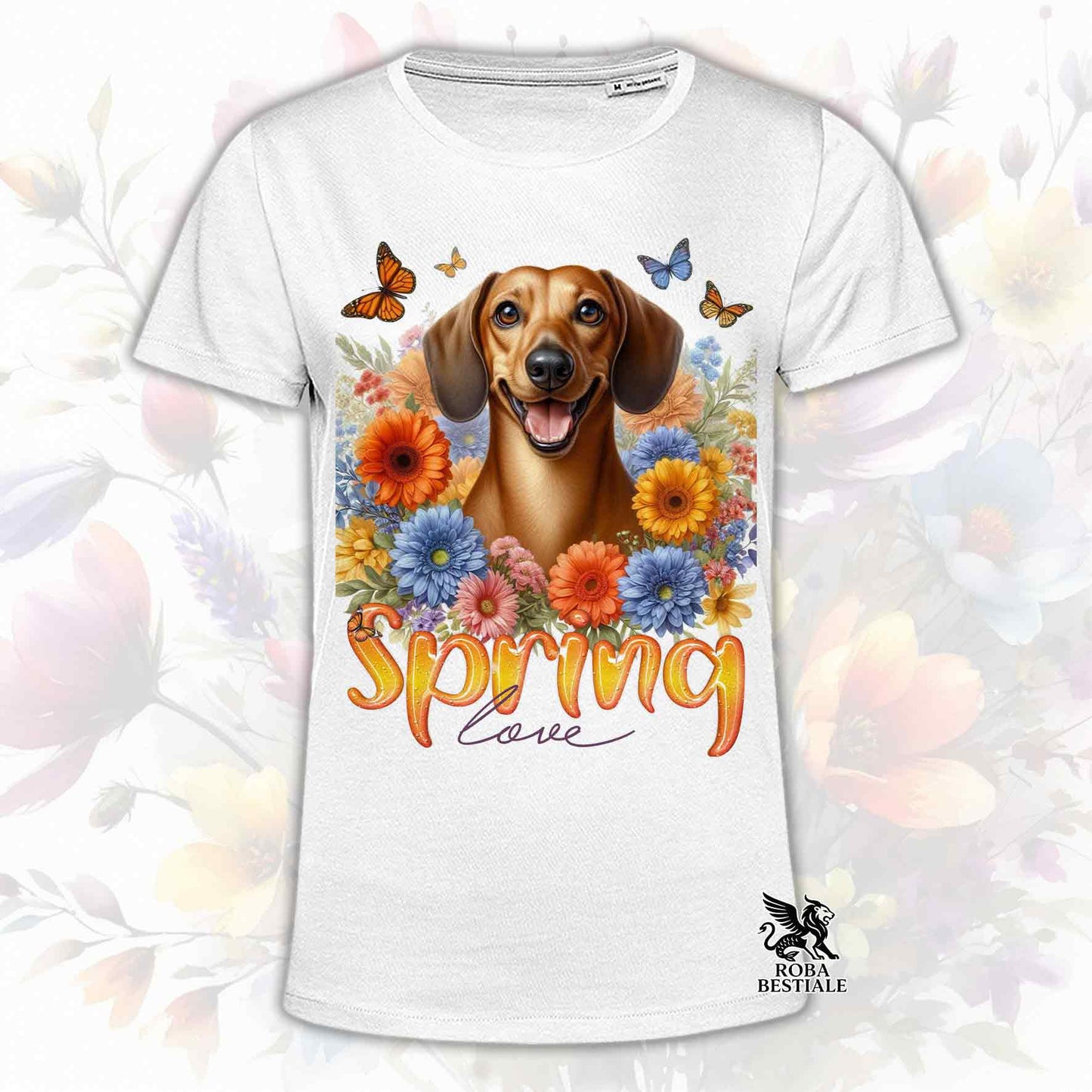 Una t-shirt bianca stampata con un Bassotto a pelo corto immerso nei fiori colorati. Collezione Spring Love di Roba Bestiale