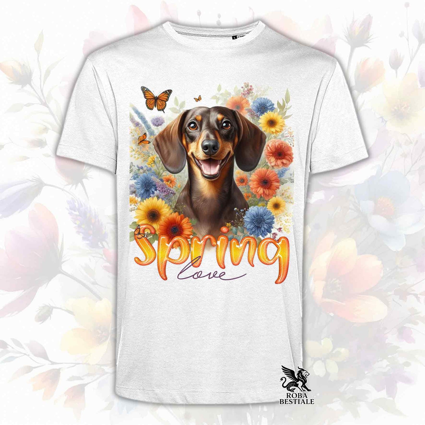 Una t-shirt bianca stampata con un Bassotto a pelo corto immerso nei fiori colorati. Collezione Spring Love di Roba Bestiale