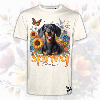 Una t-shirt beige stampata con un Bassotto a pelo corto immerso nei fiori colorati. Collezione Spring Love di Roba Bestiale