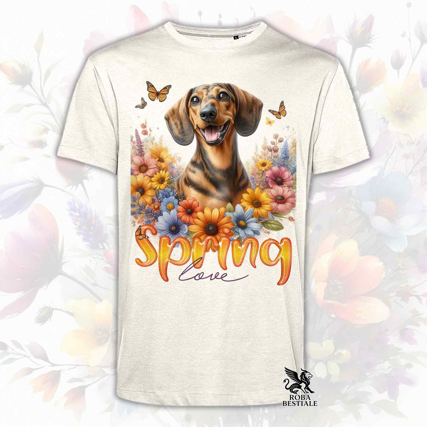 Una t-shirt beige stampata con un Bassotto a pelo corto immerso nei fiori colorati. Collezione Spring Love di Roba Bestiale