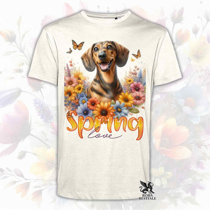 Una t-shirt beige stampata con un Bassotto a pelo corto immerso nei fiori colorati. Collezione Spring Love di Roba Bestiale