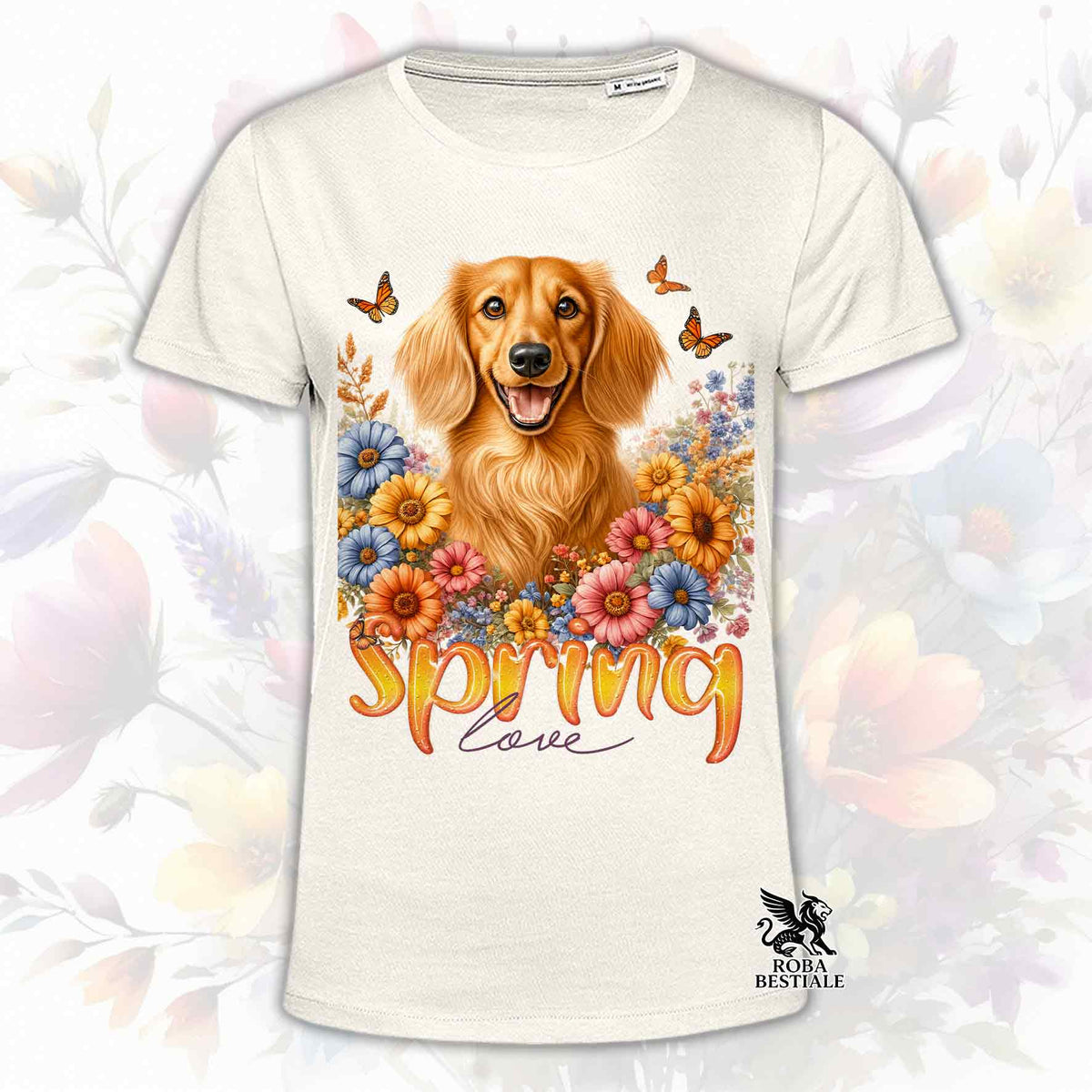 Una t-shirt beige stampata con un Bassotto a pelo lungo immerso nei fiori colorati. Collezione Spring Love di Roba Bestiale
