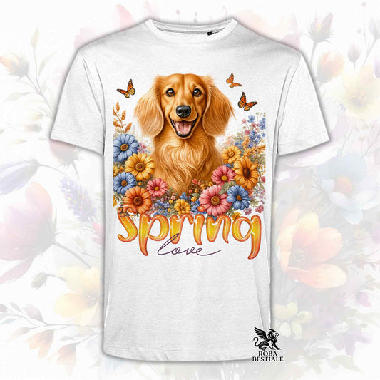 Una t-shirt bianca stampata con un Bassotto a pelo lungo immerso nei fiori colorati. Collezione Spring Love di Roba Bestiale