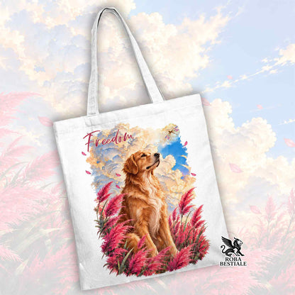 Shopper bianca con stampa di golden retriever tra fiori rosa e scritta Freedom