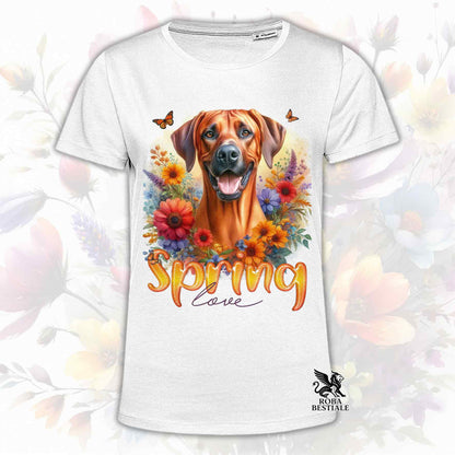 Una t-shirt bianca stampata con un Rhodesian Ridgeback immerso in fiori colorati. Collezione Spring Love di Roba Bestiale