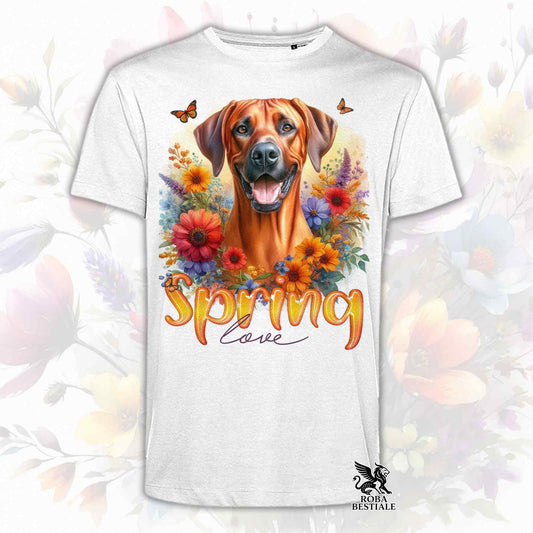 Una t-shirt bianca stampata con un Rhodesian Ridgeback immerso in fiori colorati. Collezione Spring Love di Roba Bestiale