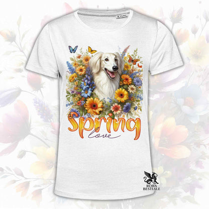 Una t-shirt bianca stampata con un Saluki immerso nei fiori colorati. Collezione Spring Love di Roba Bestiale