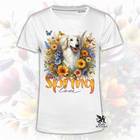 Una t-shirt bianca stampata con un Saluki immerso nei fiori colorati. Collezione Spring Love di Roba Bestiale