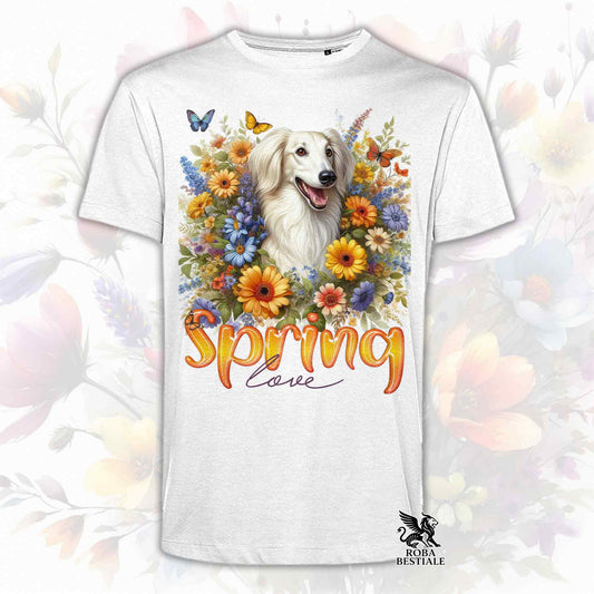 Una t-shirt bianca stampata con un Saluki immerso nei fiori colorati. Collezione Spring Love di Roba Bestiale