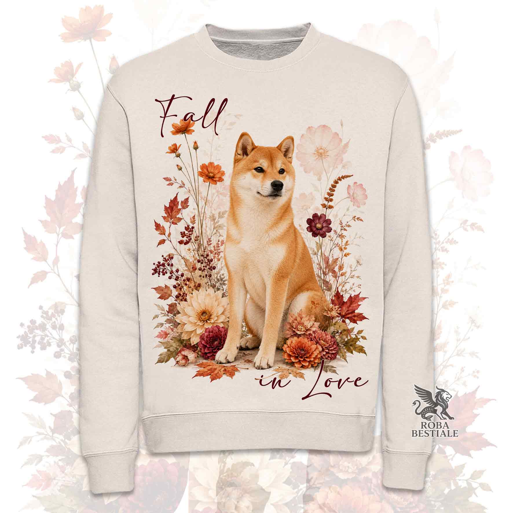 Felpa girocollo beige stampata con uno Shiba Inu seduto in mezzo a fiori e foglie autunnali. Grafica originale Roba Bestiale, collezione Fall in Love