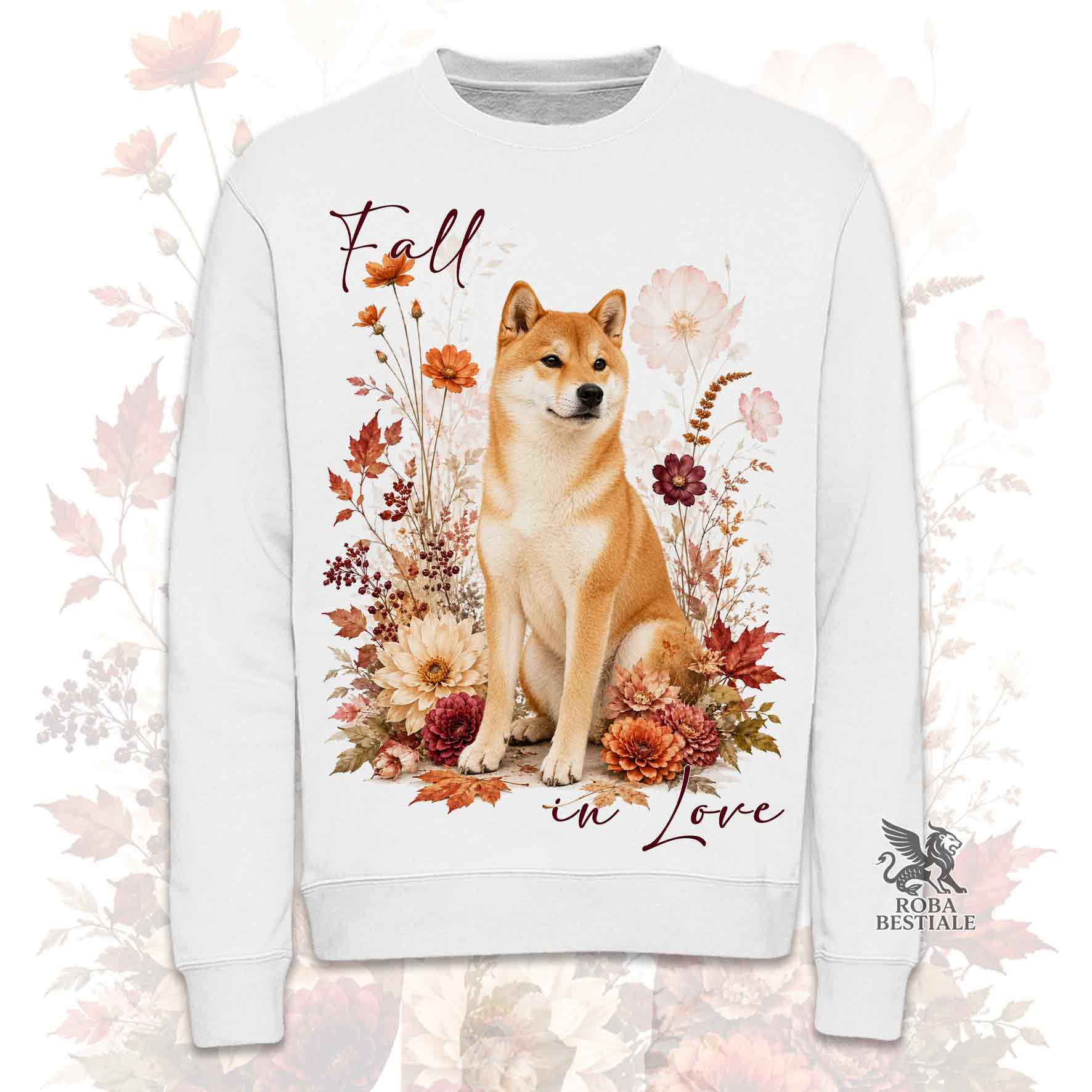 Felpa girocollo bianca stampata con uno Shiba Inu seduto in mezzo a fiori e foglie autunnali. Grafica originale Roba Bestiale, collezione Fall in Love