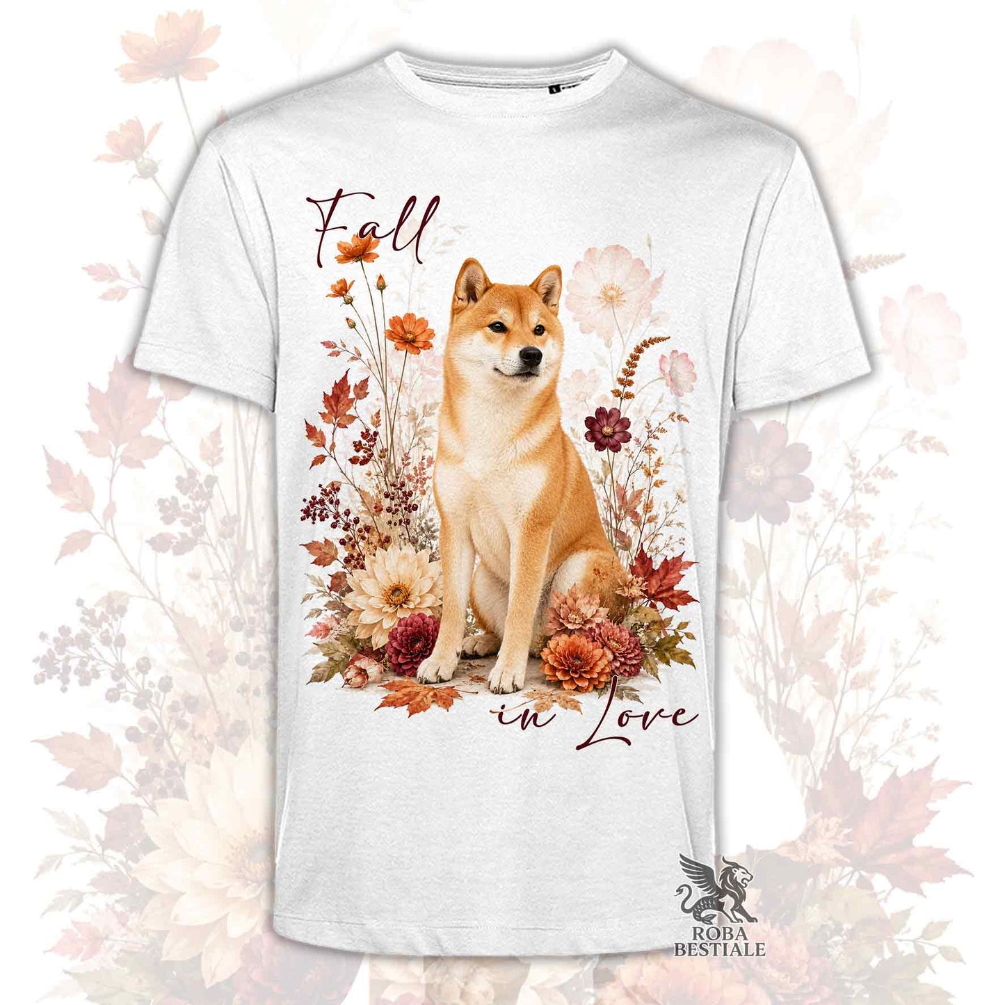 T-shirt bianca stampata con uno Shiba Inu seduto in mezzo a fiori e foglie autunnali. Grafica originale Roba Bestiale, collezione Fall in Love